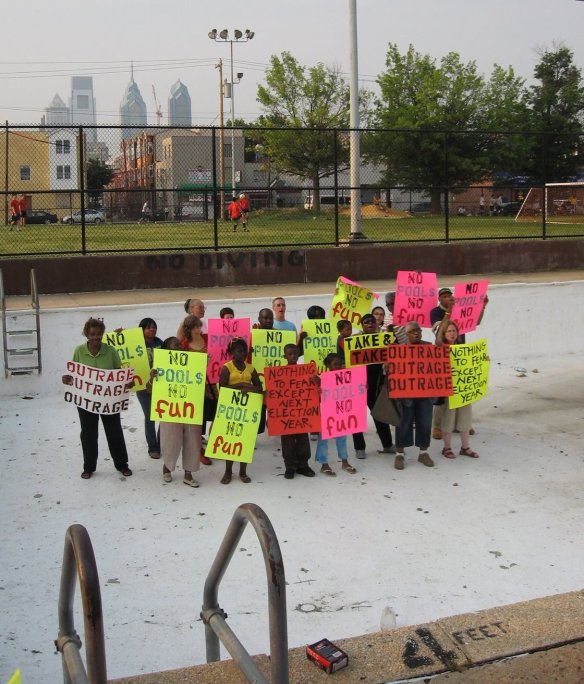 Community rally in 2009's empty pool. Photo by Coalition to Save the Libraries.