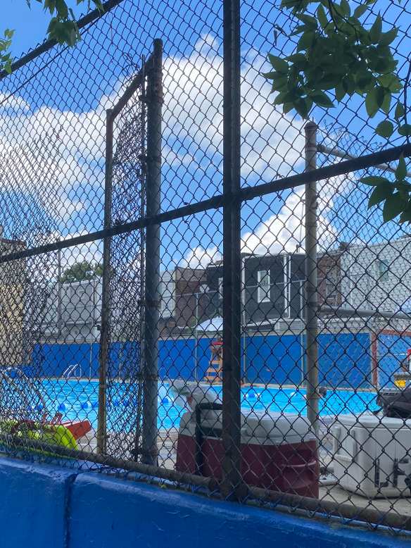 Towering gate at entrance to pool