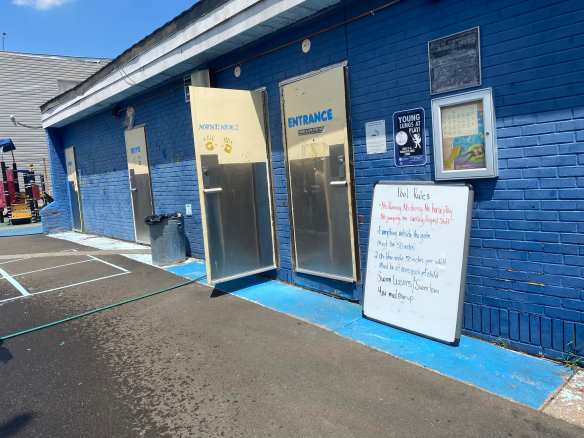 Doorway to small indoor facility building next to restrooms